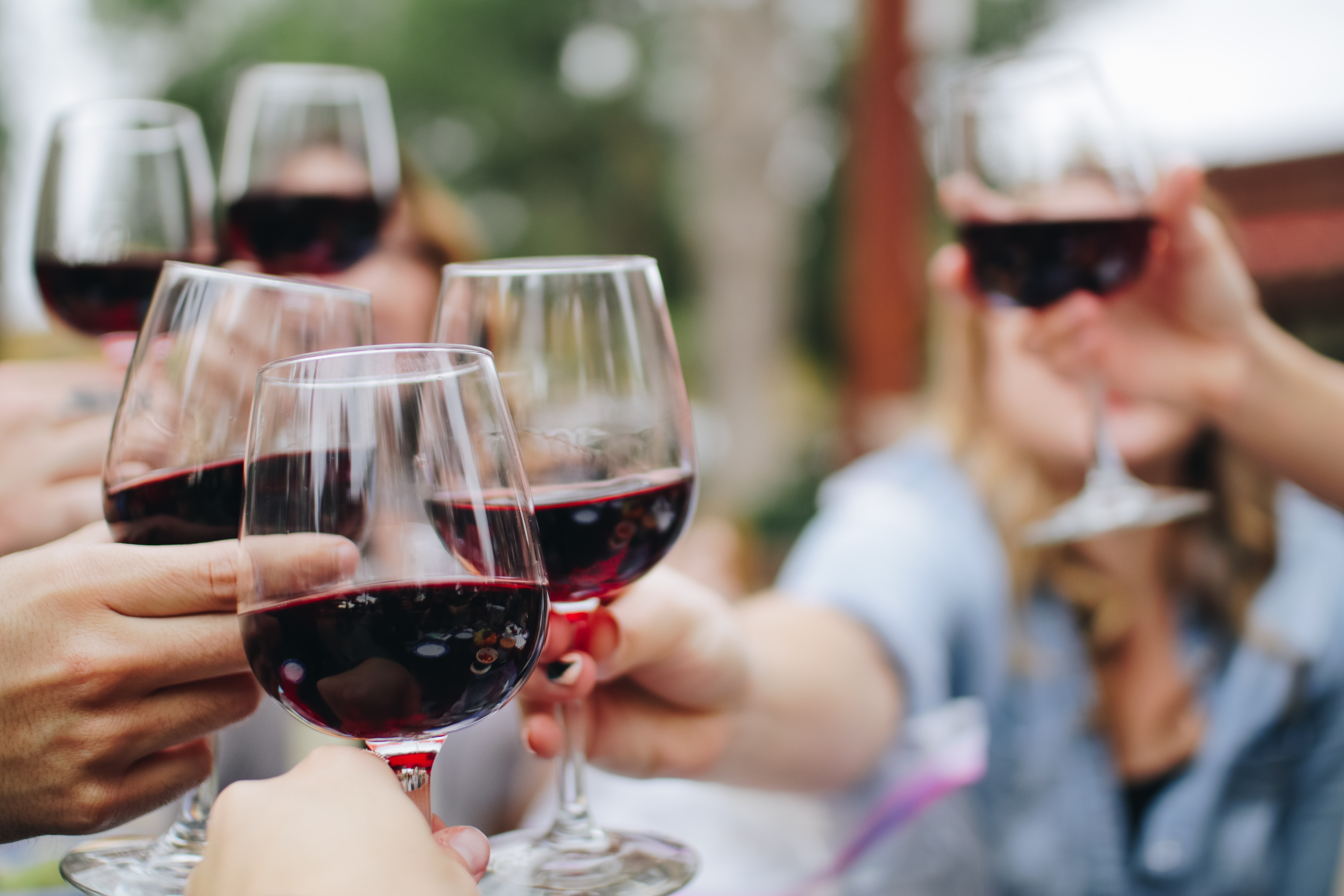 People Toasting With Wine